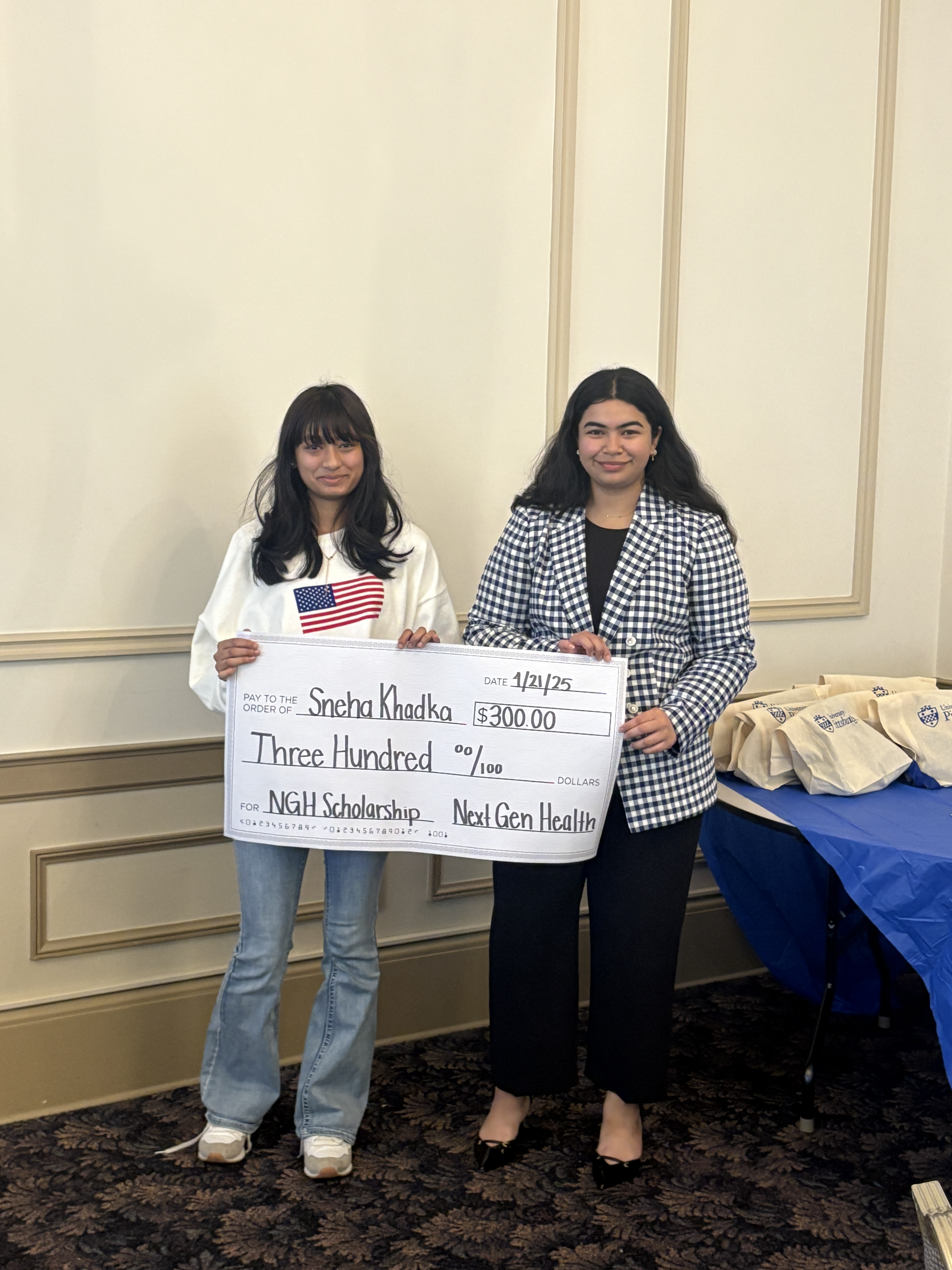 Sneha receiving scholarship